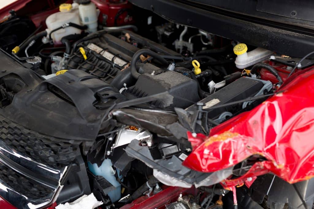 Car crash accident on street, damaged automobiles after collision in city. Сar engine