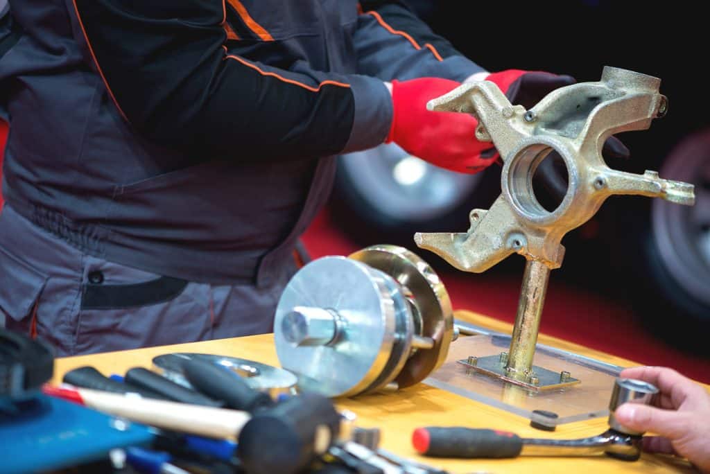 a car mechanic works in a car repair shop