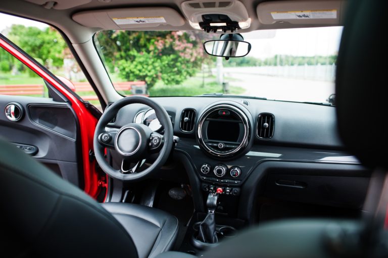 Interior of red city car. Small car for cities.